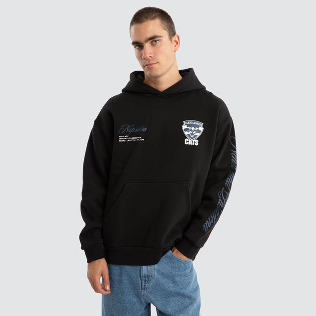Model Wears Geelong Cats AFL Season Hoodie Jet Black Hoodies in Black - Image 2