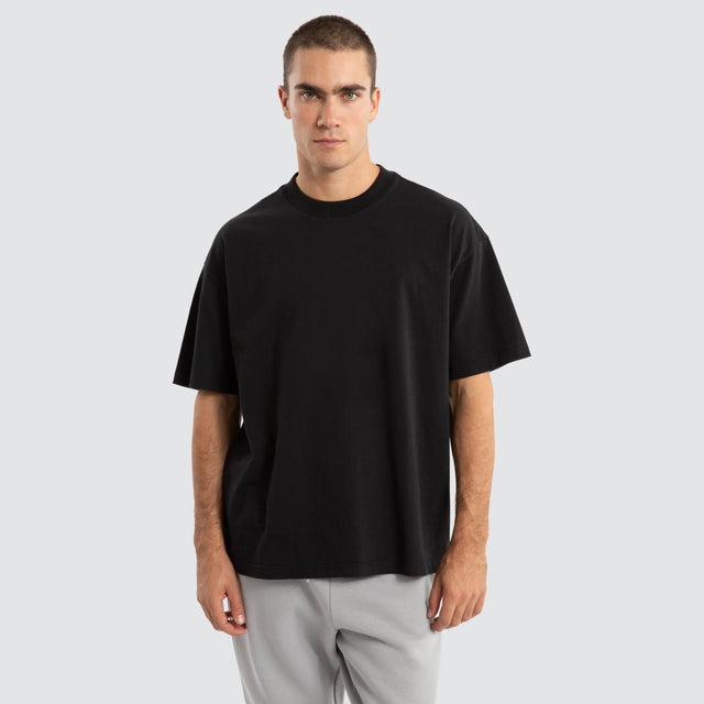 Model Wears Melville Raptor Tee Jet Black T-Shirts in Black - Image 1