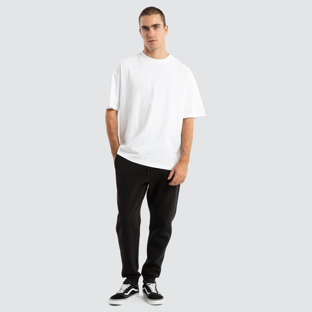 Model Wears Melville Raptor Tee Optical White T-Shirts in White - Image 2