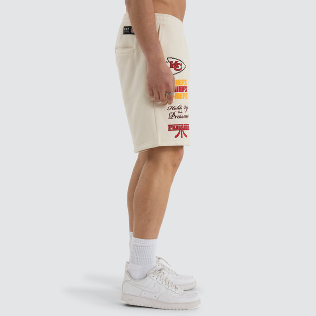 Model Wears Kansas City Chiefs NFL Shorts Tofu Shorts in Off-White - Image 9