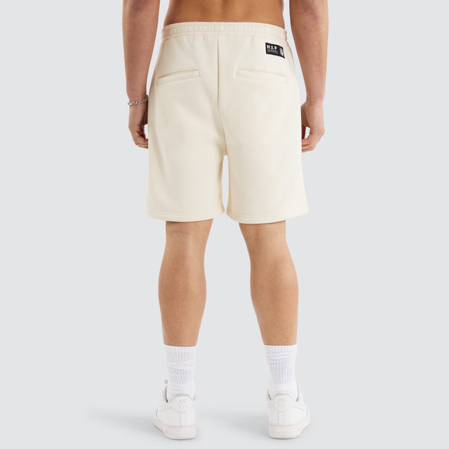 Model Wears Kansas City Chiefs NFL Shorts Tofu Shorts in Off-White - Image 8