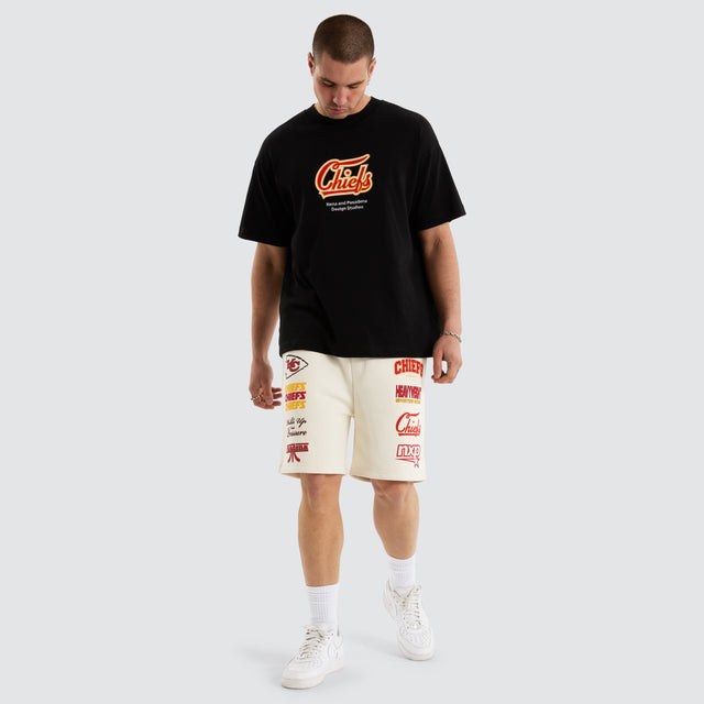 Model Wears Kansas City Chiefs NFL Shorts Tofu Shorts in Off-White - Image 4
