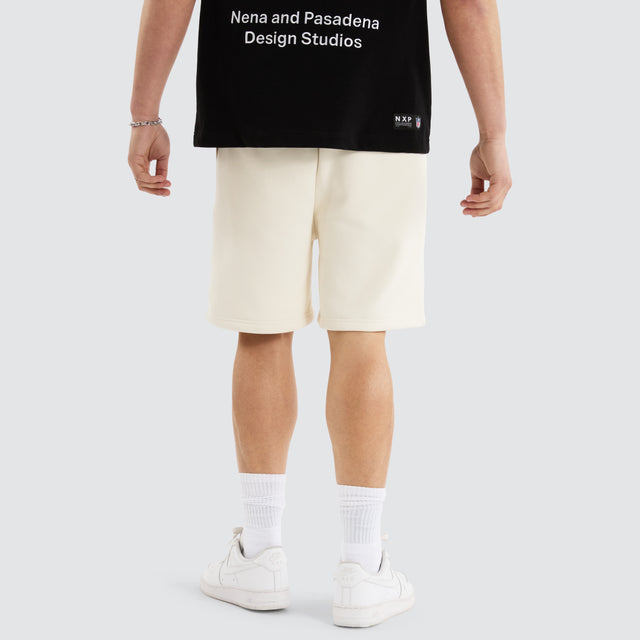 Model Wears Kansas City Chiefs NFL Shorts Tofu Shorts in Off-White - Image 11
