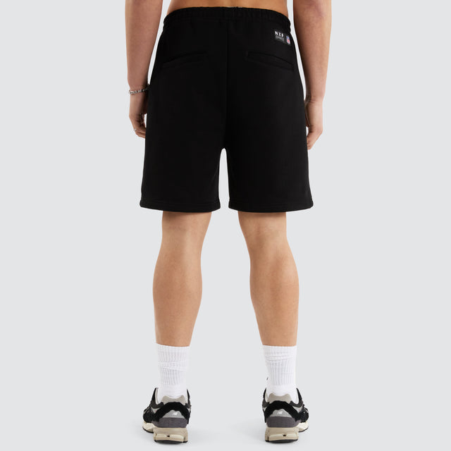 Model Wears Las Vegas Shorts  Jet Black Shorts in Black - Image 9
