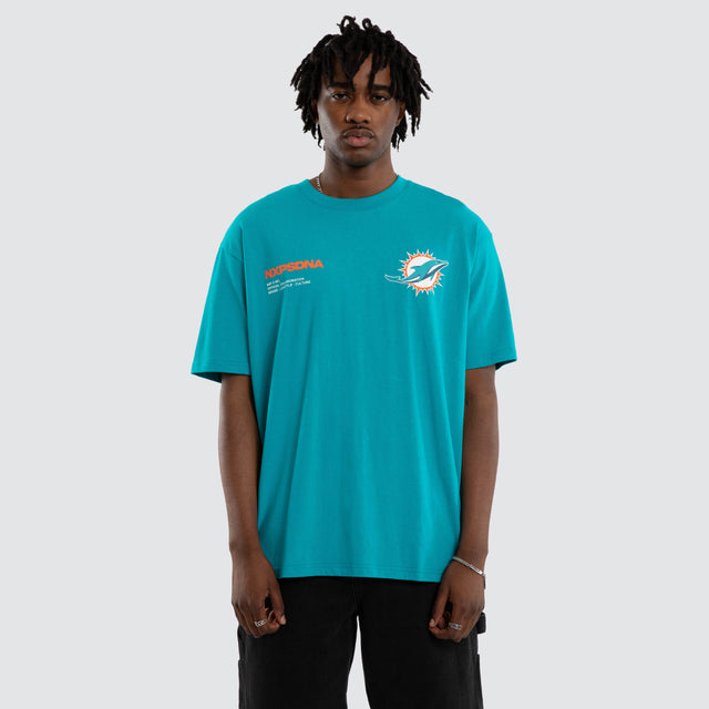 Model wears Miami Dolphins Driven Tee Aqua T-Shirts in Green - Image 4