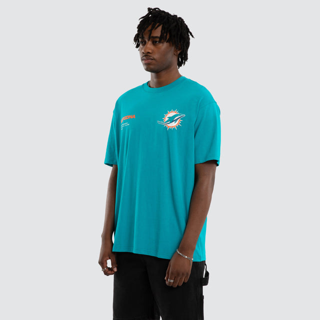 Model wears Miami Dolphins Driven Tee Aqua T-Shirts in Green - Image 5