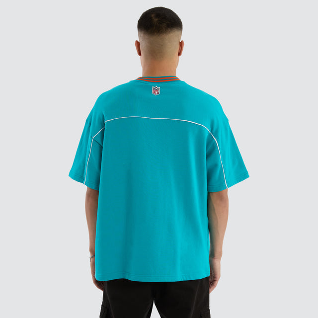Model wears Miami Dolphins Zone Tee Aqua T-Shirts in Green - Image 6