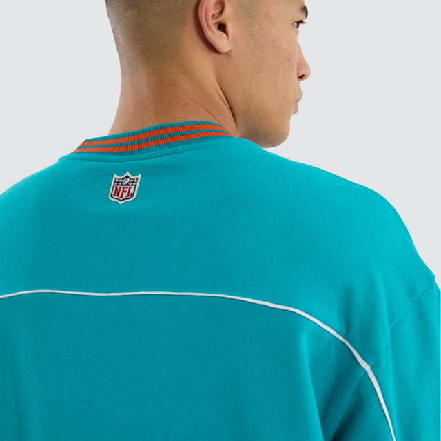 Model wears Miami Dolphins Zone Tee Aqua T-Shirts in Green - Image 7