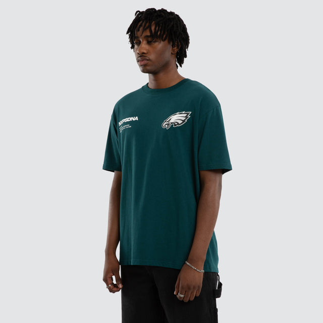 Model wears Philadelphia Eagles Driven Tee Midnight Green T-Shirts in Green - Image 6