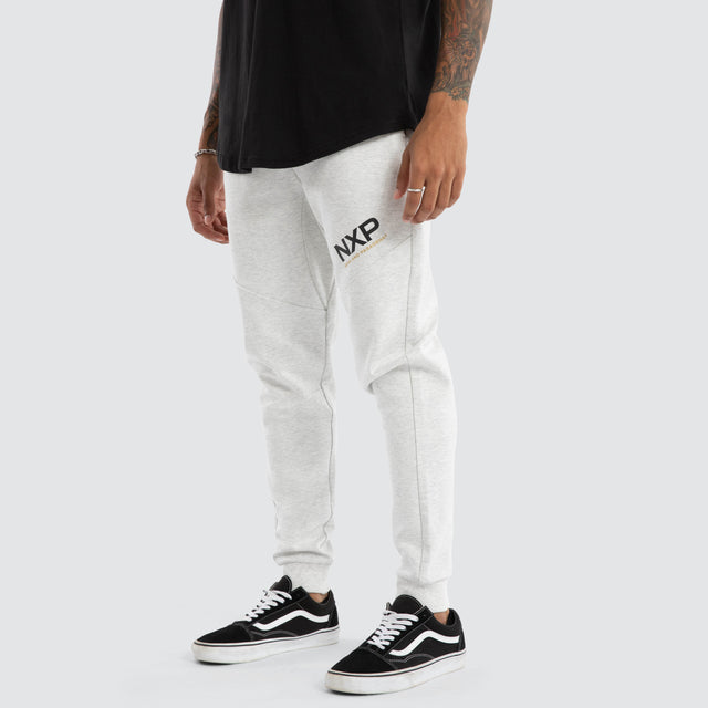 Model Wears Turret Slim Trackpant Grey Marle Trackpants in Grey - Image 1