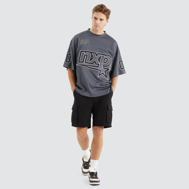 Model Wears Dayton Mesh Training Jersey Asphalt T-Shirts in Grey - Image 5