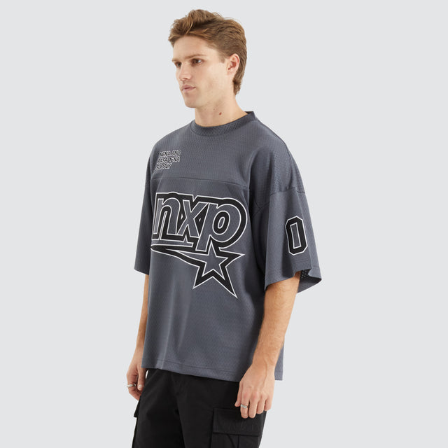 Model Wears Dayton Mesh Training Jersey Asphalt T-Shirts in Grey - Image 7
