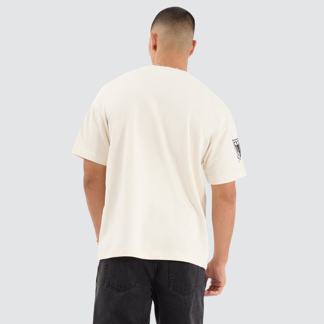 Model Wears Bounty Loopback Raptor Tee Tofu T-Shirts in Off-White - Image 4