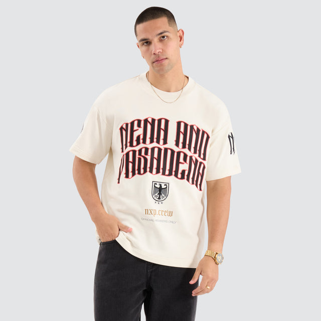 Model Wears Bounty Loopback Raptor Tee Tofu T-Shirts in Off-White - Image 1