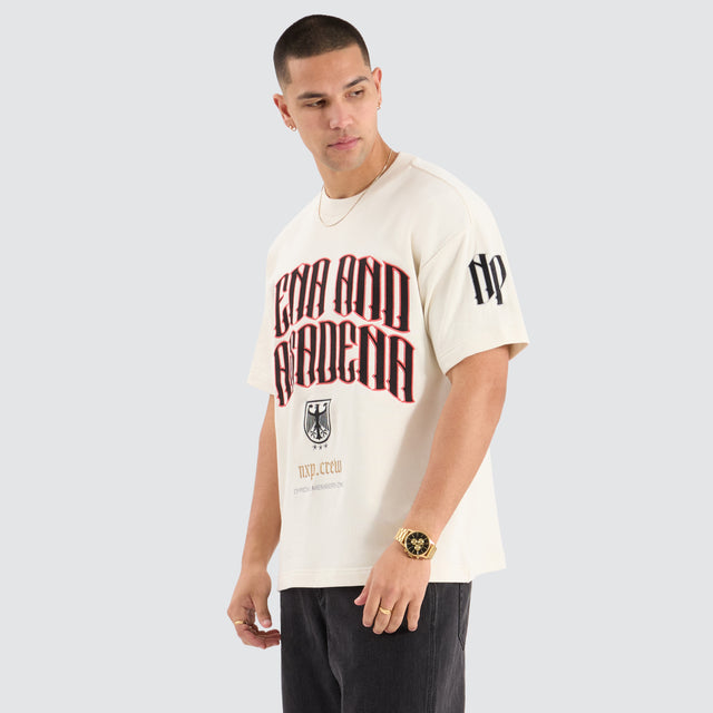 Model Wears Bounty Loopback Raptor Tee Tofu T-Shirts in Off-White - Image 3