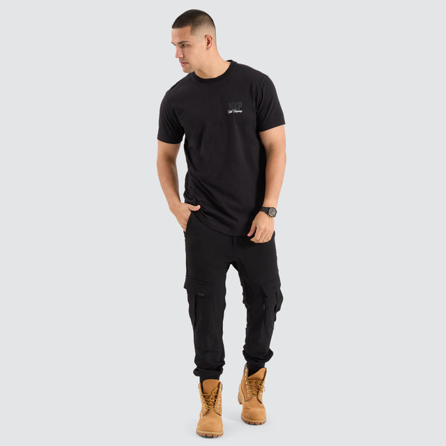Model Wears Spur Dual Curved Tee Jet Black T-Shirts in Black - Image 2