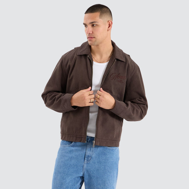 Model Wears Perche Worker Jacket Pigment Brown Jackets in Brown - Image 1