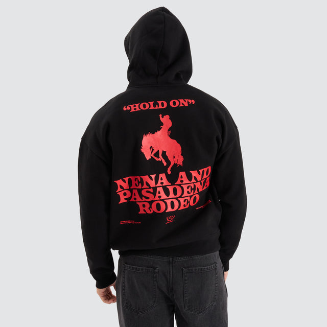 Model Wears Rodeo Box Fit Hoodie Jet Black Hoodies in Black - Image 1