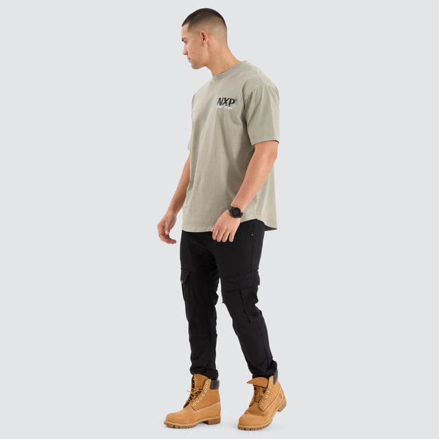 Model Wears Mirage Box Fit Tee Pigment Shadow T-Shirts in Green - Image 4