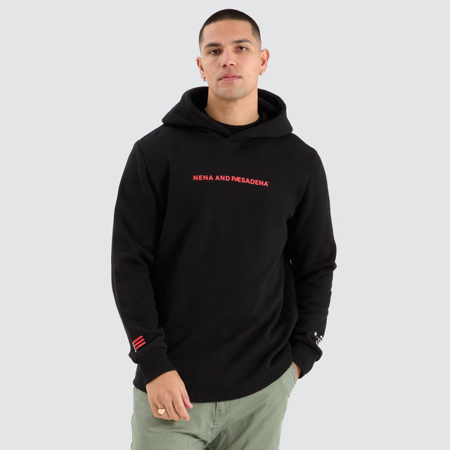 Model Wears Risk Dual Curved Hoodie Jet Black Hoodies in Black - Image 1