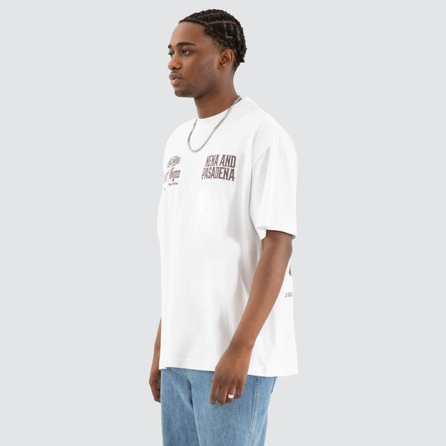 Model Wears Rattle Raptor Tee Optical White T-Shirts in White - Image 3