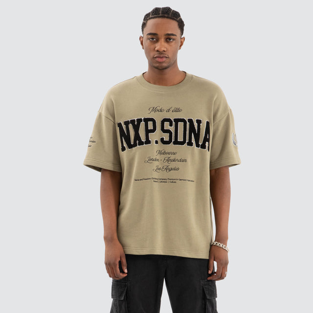 Model Wears Captain Loopback Raptor Tee Khaki Green T-Shirts in Green - Image 1