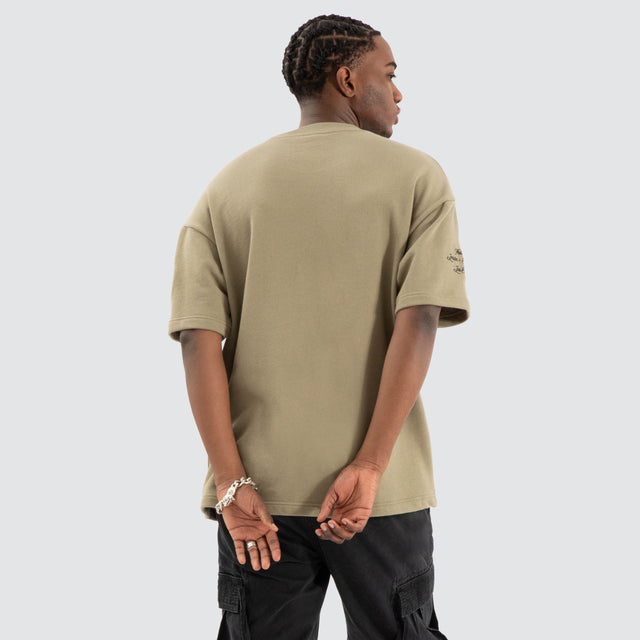 Model Wears Captain Loopback Raptor Tee Khaki Green T-Shirts in Green - Image 3