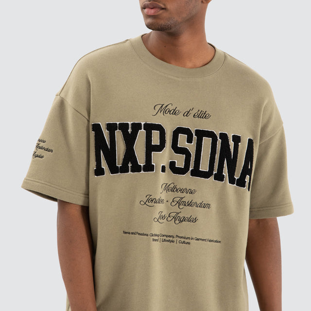 Model Wears Captain Loopback Raptor Tee Khaki Green T-Shirts in Green - Image 5