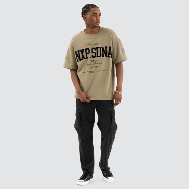 Model Wears Captain Loopback Raptor Tee Khaki Green T-Shirts in Green - Image 2