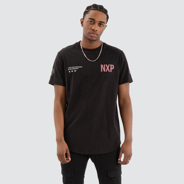 Model Wears Harbor Dual Curved Tee Jet Black/Vintage Rose T-Shirts in Black - Image 1
