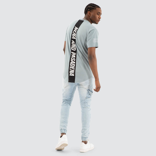 Model Wears Harbor Dual Curved Tee Lead Blue/Black T-Shirts in Blue - Image 4