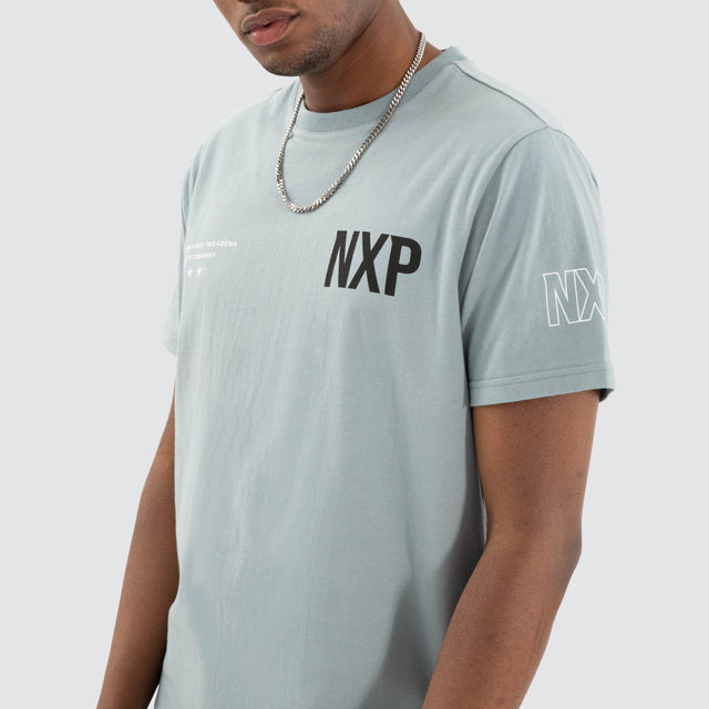 Model Wears Harbor Dual Curved Tee Lead Blue/Black T-Shirts in Blue - Image 5