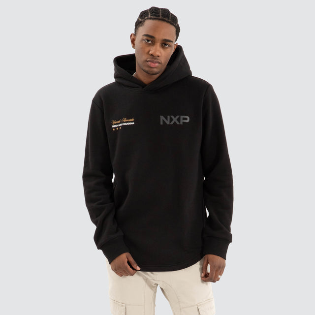 Model Wears Wild Dual Curved Hoodie Jet black Hoodies in Black - Image 1