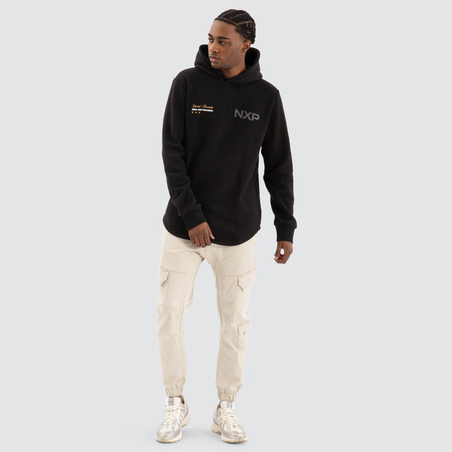 Model Wears Wild Dual Curved Hoodie Jet black Hoodies in Black - Image 2