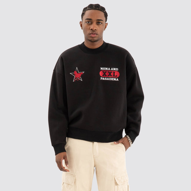 Model Wears Knight Box Fit Sweater Jet black Jumpers in Black - Image 4