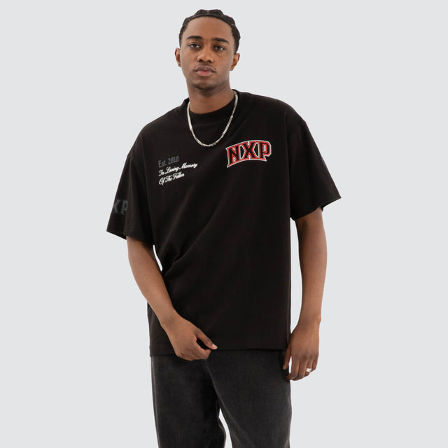 Model Wears Knockout Raptor Tee Jet Black T-Shirts in Black - Image 2