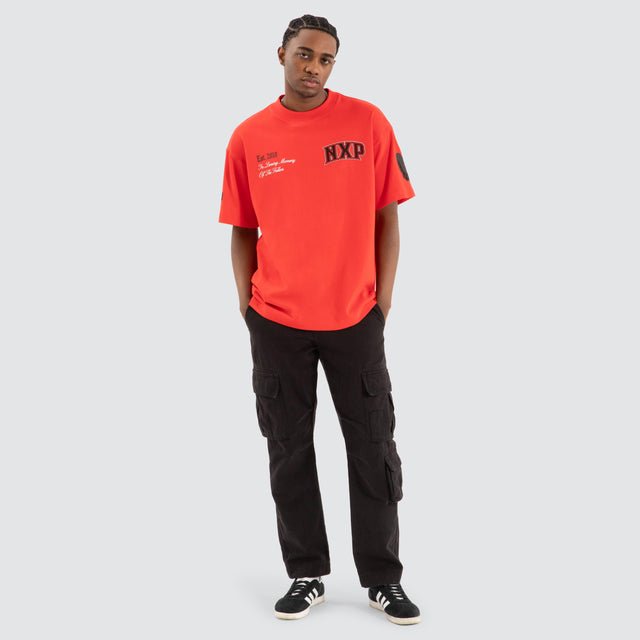 Model Wears Knockout Raptor Tee Poppy Red T-Shirts in Red - Image 2