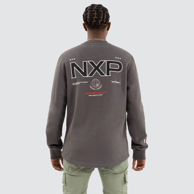Model Wears Thunder Dual Curved Sweater Asphalt Grey Jumpers in Grey - Image 1
