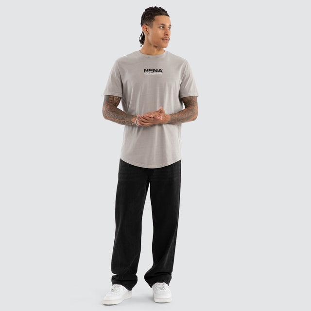 Model wears Veered Curved Hem Tee Pigment Paloma Grey T-Shirts in Grey - Image 5