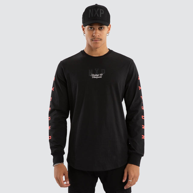 Model wears Final Dual Curved Longsleeve Tee Jet Black Longsleeve T-Shirts in Black - Image 2