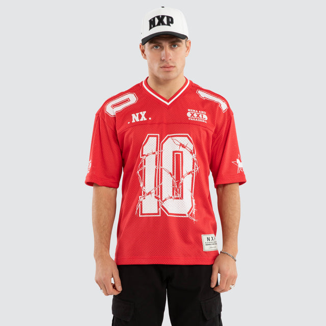 Model wears Wired Gridiron Jersey Red Jerseys in Red - Image 1