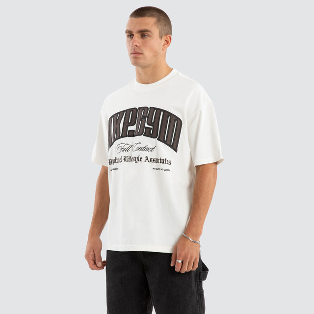Model wears Citizens Raptor Tee Natural White T-Shirts in White - Image 3