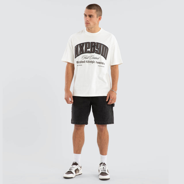 Model wears Citizens Raptor Tee Natural White T-Shirts in White - Image 5