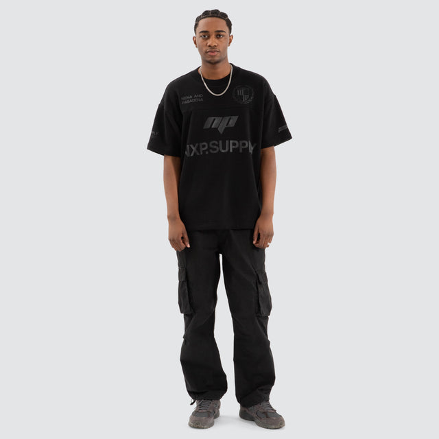 Model Wears Power Loopback Raptor Tee Jet Black T-Shirts in Black - Image 2