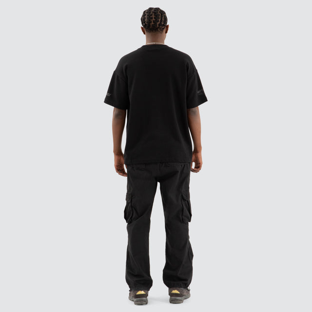 Model Wears Power Loopback Raptor Tee Jet Black T-Shirts in Black - Image 3