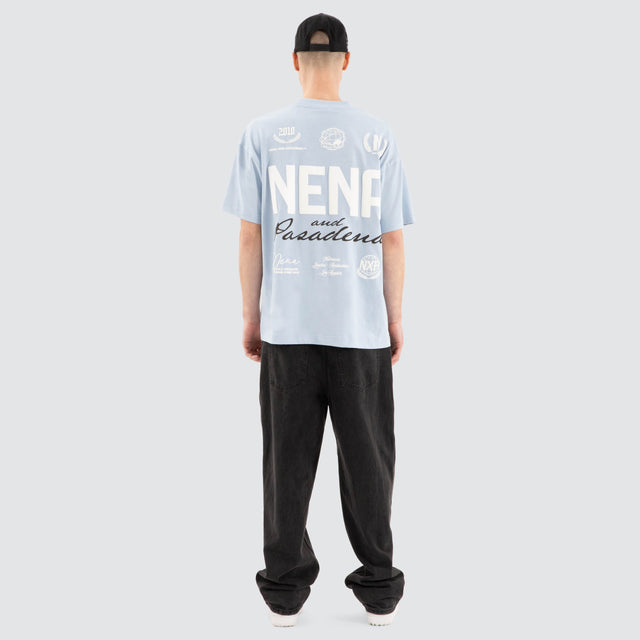 Model Wears Global Raptor Tee Skyway T-Shirts in Blue - Image 4