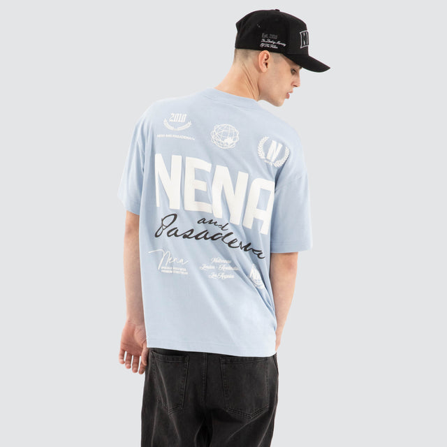 Model Wears Global Raptor Tee Skyway T-Shirts in Blue - Image 1