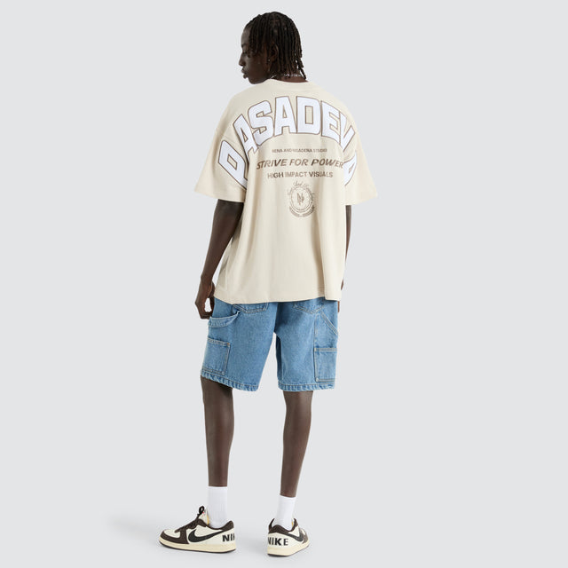 Model Wears Armour Loopback Raptor Tee Moonbeam T-Shirts in Off-White - Image 4