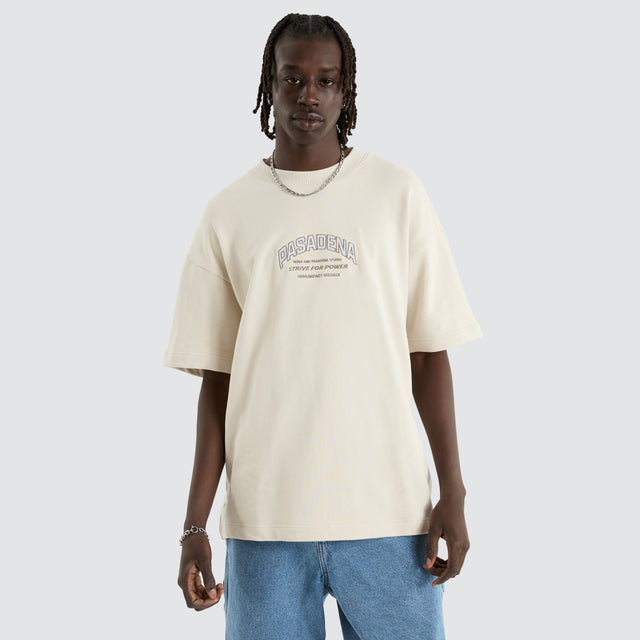 Model Wears Armour Loopback Raptor Tee Moonbeam T-Shirts in Off-White - Image 3