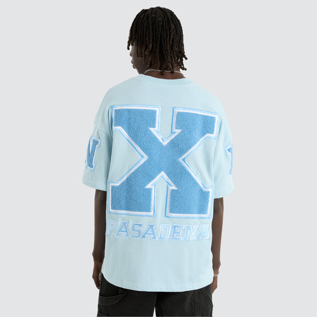 Model Wears Big X Loopback Raptor Tee Baby Blue T-Shirts in Blue - Image 1